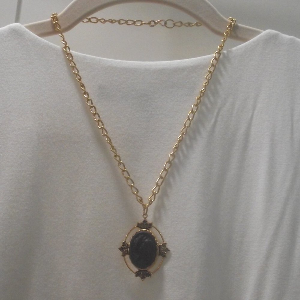 Black cameo with ornate frame